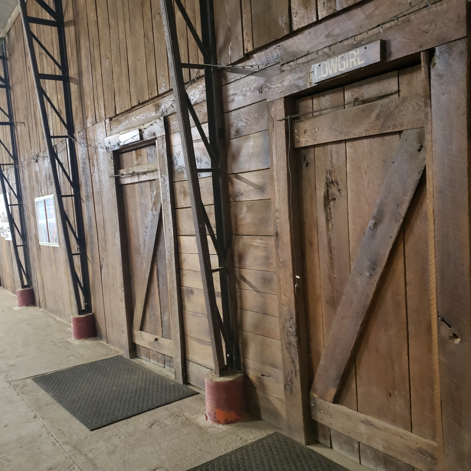 Restrooms at Civil War Arena with Cowgirl and Cowboy placards