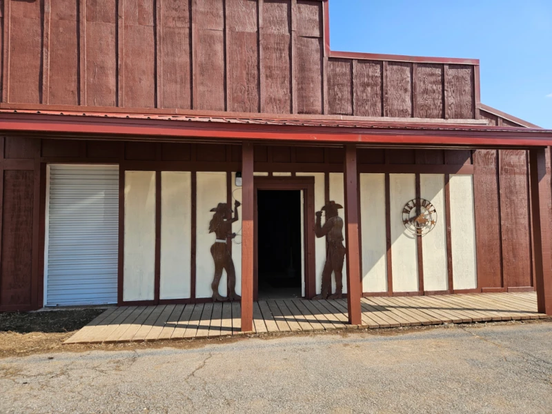 Entrance to Civil War Arena is flanked by two life-size cutouts of a cowgirl and cowboy.